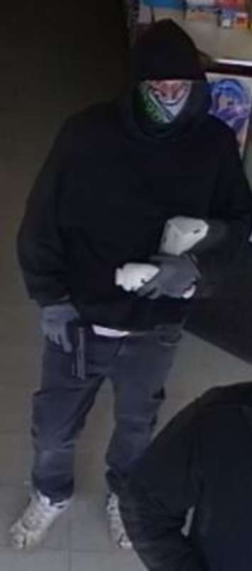 The first suspect in a pharmacy holdup in Windsor, February 11, 2020. Photo taken from surveillance camera via Windsor police.