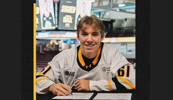 Jordan Bax signs with the Sarnia Sting (Photo courtesy of Sarnia Sting via Facebook)