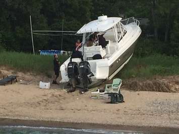 Police respond after a boat crashes into the shore near Canatara Park Beach, July 3, 2015. (Photo by Sue Storr)