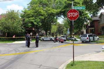 Windsor police investigate a crash involving a motorcycle and van at the intersection of Chilver Rd. and Richmond St., June 4, 2015. (Photo by Jason Viau)