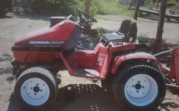 The Red Honda lawn tractor stolen from Michener Auto Body on Grand Avenue East. 
