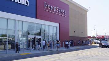 A line of shoppers outside the Marshalls-HomeSense in Sarnia on day one of Ontario’s three-phase reopening plan.  11 June 2021.  (BlackburnNews.com photo by Colin Gowdy)