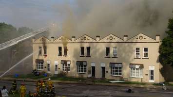 A row of townhouses on fire in August of 2015. (Photo by Kirk Scott)