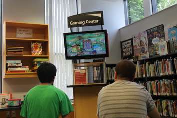 Elementary school students play video games at the Windsor Public Library branch on Seminole St., June 19, 2017. (Photo by Mike Vlasveld)