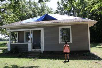 Two tree branches caused signifcant damage to the roof of a house in Kent Bridge on July 28. (Photo by Michael Hugall) 