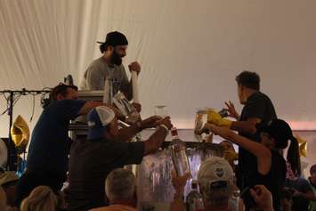 Ingredients are added for the World Records attempt at the largest Bloody Mary cocktail. (Photo by Angelica Haggert)