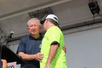 Retiring Windsor-Tecumseh MP Joe Comartin embraces Windsor-West MP Brian Masse September 7, 2015.  (Photo by Adelle Loiselle)