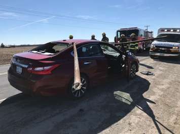 Police have charged a truck driver after a pole fell off a vehicle and struck a car travelling behind it. (Photo courtesy of the OPP)