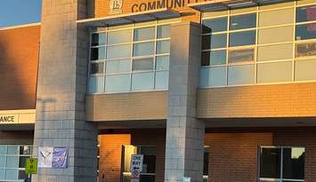 A flower memorial out front of Walkerton District Community School in honour of a teacher and four students killed in a crash northeast of London, May 25, 2025. (Photo by JC Coutts, Blackburn Media)