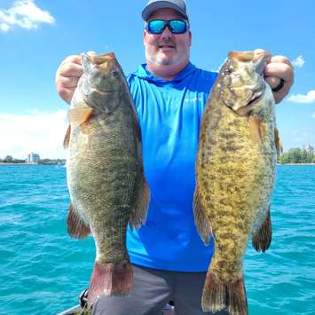 Rob Matthews shows off a pair of fish at the Great Lakes Super Series at Sarnia Bay.  6 August 2022. (Photo by Great Lakes Super Series)