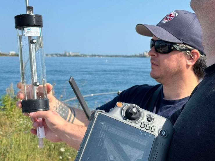 An Imperial staff member shows off the tube used to take water samples with a new drone. October, 2024 Image courtesy of Digital Lead Aaron Huggett.