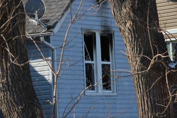 Firefighters at the scene of two house fires in the 800-block of Assumption St. in Windsor March 2, 2015. (Photo by Adelle Loiselle.)