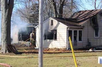 Essex firefighters battle a residential blaze in the 100-block of Park St. in Harrow, March 18, 2015. (Photo by Mike Vlasveld)