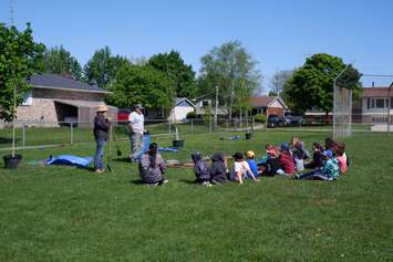 Kelley Elliott, Health Promoter at Lambton Public Health and Tim Payne, Manager of Forestry at the St. Clair Region Conservation Authority talk to Petrolia’s Queen Elizabeth II Public School students about both the health and environmental benefits of trees as part of the Tomorrow’s Greener Schools Today – Lambton program. Submitted photo.