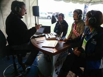 CKNX morning host Buzz Reynolds welcomes IPM guests including from left to right: John Taylor, Pres. of Mutual Insurance Association; Queen of the Furrow, Anita Rastapkevicius; Lynne Godkin, secretary of the IPM committee. (Photo courtesy of CKNX)