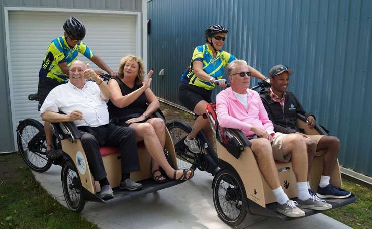 MPP Bob Bailey, MP Marilyn Gladu, Councillor George Vandenberg, and Councillor Adam Kilner test ride the trishaws. August 18, 2023. (Photo by Natalia Vega)