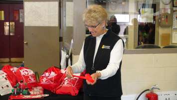 Gayle Bailey from Invisible Fence, shows off animal rescue kits that will be located at all fire stations in Chatham-Kent (Photo taken by Jake Kislinsky).