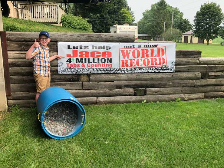 Jace Weber worked hard to set a world record, recycle can tabs, and donate to the March of dimes. Photo by Candice Weber