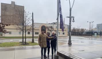 A flag is raised at Windsor City Hall to mark International Day for the Elimination of Violence Against Women, November 25, 2025. (Photo by Maureen Revait)