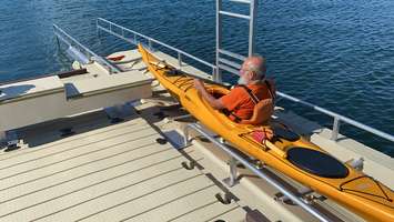 A kayaker uses the new accessible canoe and kayak launch just south of the Suncor Agora in Centennial Park. August 6, 2020 Photo by Melanie Irwin