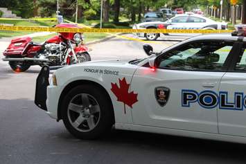 Windsor police investigate a crash involving a motorcycle and van at the intersection of Chilver Rd. and Richmond St., June 4, 2015. (Photo by Jason Viau)