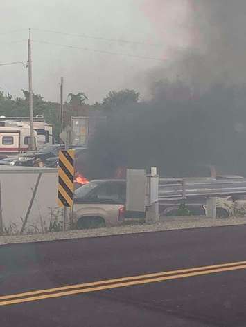A fire is seen in the area of Tilbury Auto Sales on August 18, 2018. Photo courtesy of Clare Tellier-Washburn/Facebook.