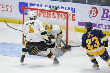 Sting goaltender Anson Thornton makes a save versus the Erie Otters.   November 7, 2021.  (Metcalfe Photography)