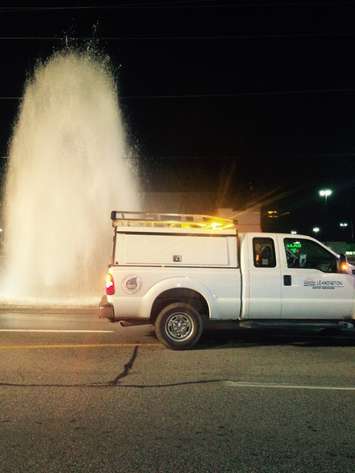 Emergency crews respond to Erie St. in Leamington after a vehicle collided with a fire hydrant, October 19, 2016. (Photo courtesy of the Leamington Fire Service) 