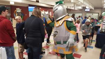 Scorezy, the London Knights mascot, entertains fans in the lobby of the Eastlink Arena in Clinton. (Photo by Steve Sabourin)