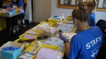 Staff at at the high-output COVID immunization clinic at Clearwater Arena.  25 June 2021.  (BlackburnNews.com file photo)