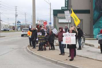 Protestors on Tecumseh Road East and Walker Road, Windsor, December 12, 2022. Photo by Mark Brown/WindsorNewsToday.ca.