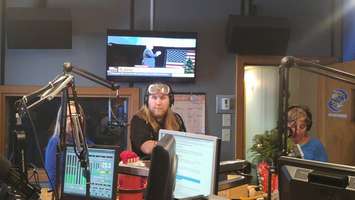 Max Major, morning host for K 106.3, gets ready to test his impaired driving skills on the virtual car simulator. Dec. 13, 2017. (Photo by Colin Gowdy)