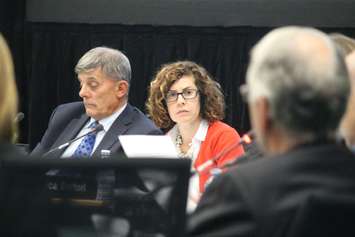 Acting board chair Alan Halberstadt, left, and trustee Jessica Sartori talk about school closures, October 13, 2015. (Photo by Jason Viau)
