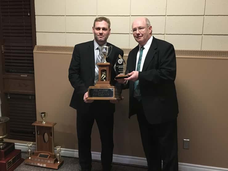 Jason Brooks (left) of the Listowel Cyclones accepts his award for Coach of the Year from Doug Black for the 2017-18 season. (Photo by Ryan Drury)
