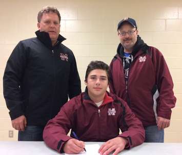 Eric Carter signs with Chatham Maroons.  (Photo courtesy of Maroons)
