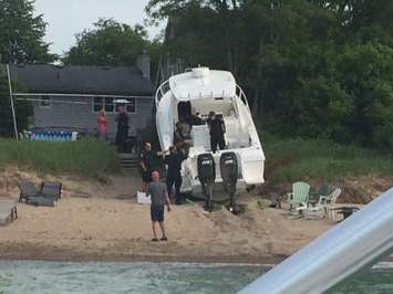 Police respond after a boat crashes into the shore near Canatara Park Beach, July 3, 2015. (Photo by Sue Storr)