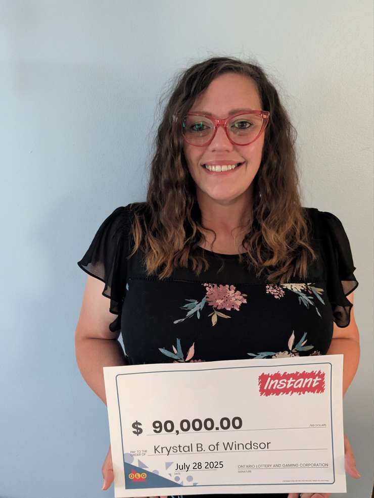 Krystal Bondy-Rafael displays her $90,000 prize cheque at the OLG Prize Centre in Toronto. Photo supplied by OLG.