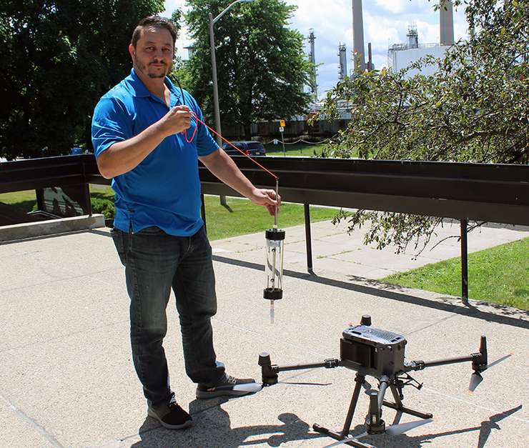 Imperial Digital Lead Aaron Huggett shows off a new drone that takes water samples. October, 2024 Image courtesy of Aaron Huggett.