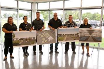 Artist's renderings are displayed for a proposed pickleball complex at Essex Centre Sports Complex, August 28, 2024. Seen are, from left, Councillor Katie McGuire-Blaise, Mayor Sherry Bondy, PickleBarn Program Manager Evan Hollinsky, Councillor Brad Allard, PickleBarn General Manager Scott Hollinsky, and Councillor Kim Verbeek.