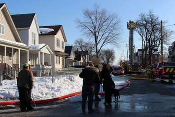 Firefighters at the scene of two house fires in the 800-block of Assumption St. in Windsor March 2, 2015. (Photo by Adelle Loiselle.)