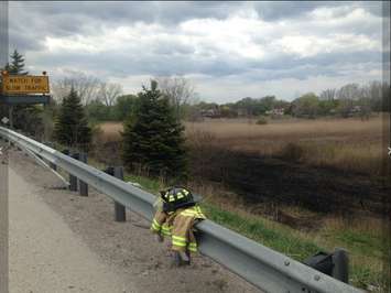 Grass fire on Hwy. 402 near Modeland Rd. May 16, 2016 Photo courtesy of Sarnia Fire and Rescue Services via Twitter.