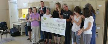 100 Women Who Care present a check to Chatham Hope Haven for the biggest donation in the organizations history since the group was created less than two years ago. June 15, 2018. (Photo by Greg Higgins.)