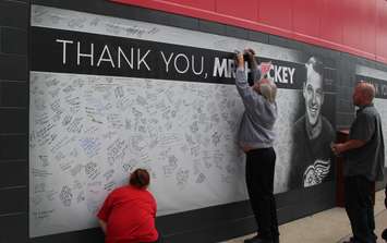 Fans write messages to Gordie Howe as the family holds visitation inside Joe Louis Arena, June 14, 2016. (Photo by Maureen Revait)