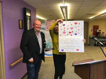 Pathways Executive Director Jenny Greensmith presents Smilezone Foundation Co-Founder Scott Bachly with a Thank You Card. February 4, 2019 Photo by Melanie Irwin