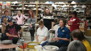 Ceramics Professor Beth Turnbull Morrish helping local celebrities at the Bowl-a-Thon. February 23, 2018. (Photo by Colin Gowdy, Blackburn News)