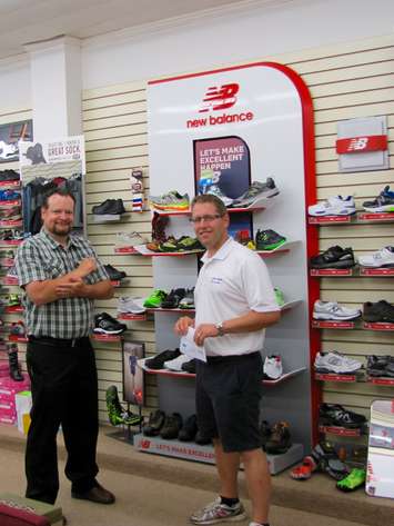 Corey McLeod, co-owner of Knapp's Shoes & Clothing(left) with John Nater in Listowel. 