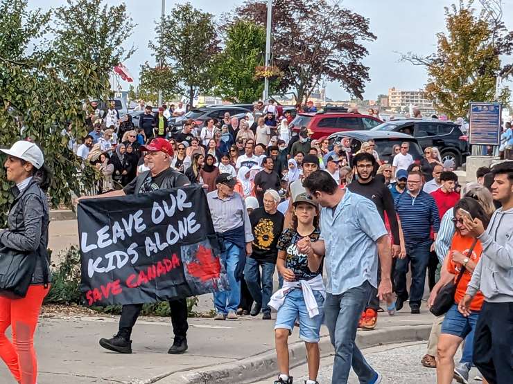 A crowd begins the 1MillionMarch4Children Rally at Dieppe Gardens, Windsor, September 20, 2023. Photo by Mark Brown/WindsorNewsToday.ca.