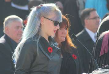 Grade 8 student at Dougall Public School Alyssa Postma reads her poem 'It Takes A Superhero' at Windsor's Remembrance Day ceremony, November 11, 2015. (Photo by Mike Vlasveld)