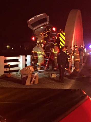 A vehicle collides with the River Canard bridge in Amherstburg, December 6, 2015. (Photo courtesy of the Amherstburg Fire Department)
