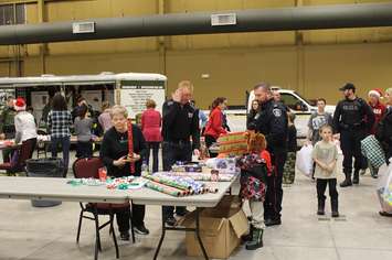 Gift wrapping area at the John D. Bradley Convention Centre. December 17, 2016. Photo by Natalia Vega)